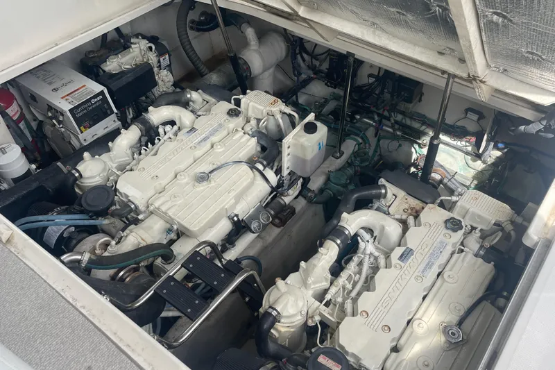 Maddie Janes Yacht Photos Pics Engine compartment of a 2009 Sea Ray 40 Sundancer boat, showcasing dual engines.