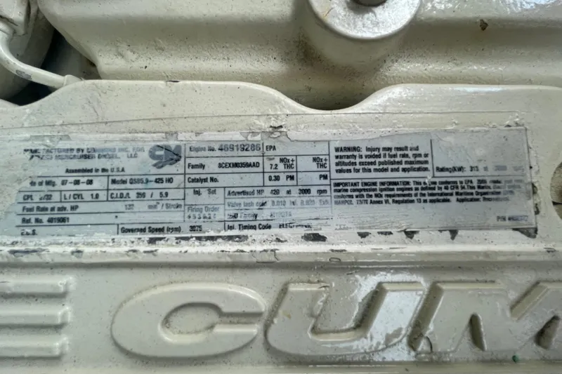 Maddie Janes Yacht Photos Pics Engine label on a 2009 Sea Ray 40 Sundancer boat, featuring Cummins branding.