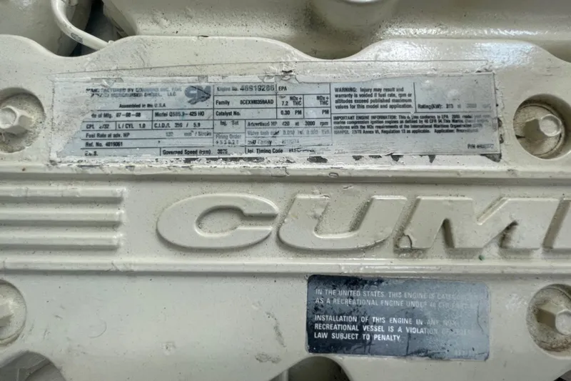 Maddie Janes Yacht Photos Pics Engine label on a 2009 Sea Ray 40 Sundancer, featuring Cummins branding.