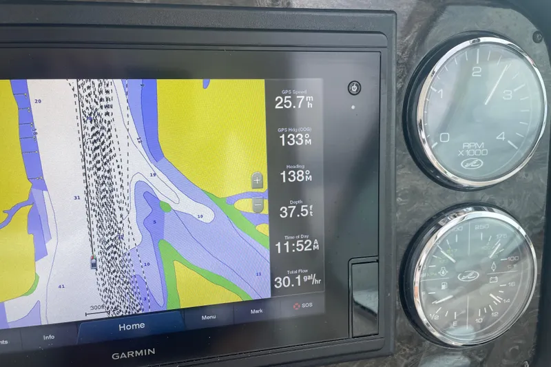 Maddie Janes Yacht Photos Pics Garmin navigation display on 2009 Sea Ray 40 Sundancer boat dashboard with gauges.
