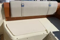 2023 Invictus GT280 boat interior with beige seating and wooden deck.