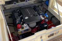 2023 Invictus GT280 engine compartment with detailed view of the motor and components.