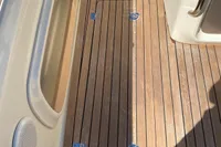 2023 Invictus GT280 boat deck with teak flooring and seating area.