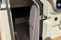 2023 Invictus GT280 cabin entrance with Garmin navigation system on deck.