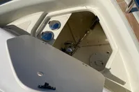 2023 Invictus GT280 boat anchor compartment with open hatch and stainless steel fittings.