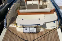 2023 Invictus GT280 boat for sale, docked with wooden deck and seating area.