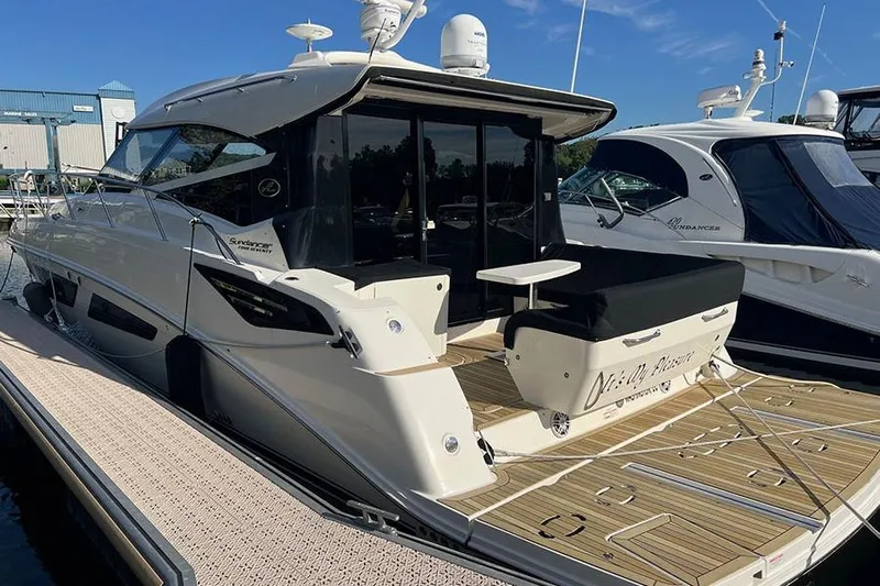  Yacht Photos Pics 2015 Sea Ray 470 Sundancer yacht docked at marina, showcasing sleek design and spacious deck.