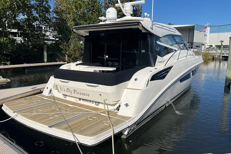  Yacht Photos Pics 2015 Sea Ray 470 Sundancer yacht docked in marina, rear view.