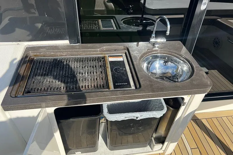  Yacht Photos Pics Outdoor kitchen on 2015 Sea Ray 470 Sundancer yacht with grill and sink.