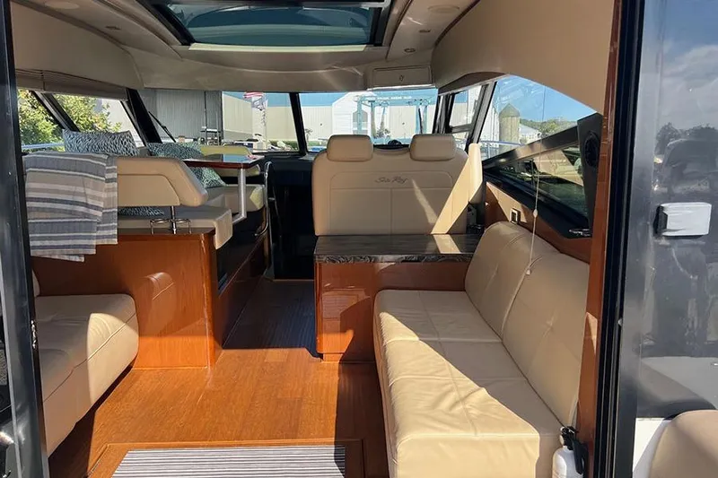  Yacht Photos Pics Interior of 2015 Sea Ray 470 Sundancer yacht with luxurious seating and wood finishes.