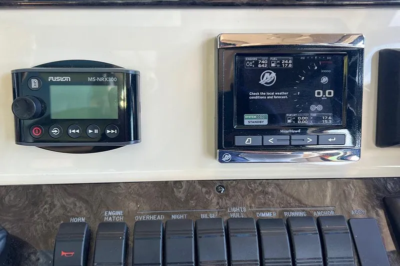  Yacht Photos Pics Control panel of a 2015 Sea Ray 470 Sundancer with Fusion MS-NRX300 and VesselView displays.