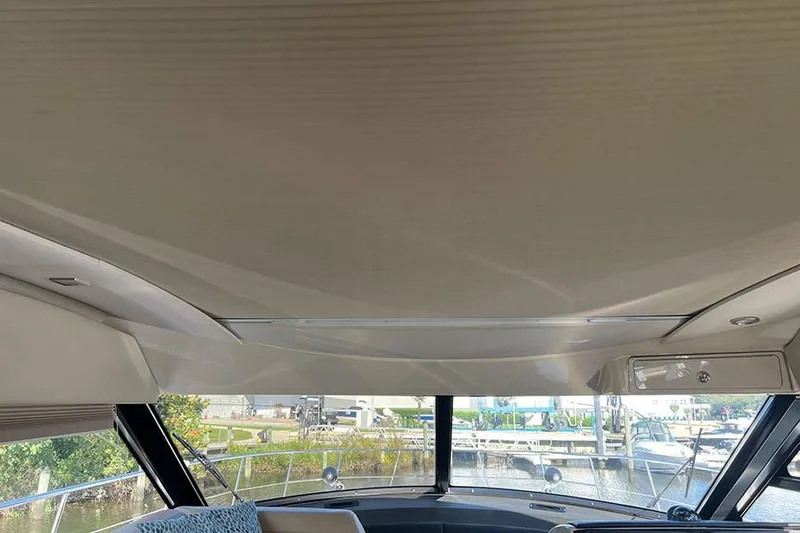  Yacht Photos Pics Interior view of 2015 Sea Ray 470 Sundancer yacht with large windows and sleek design.