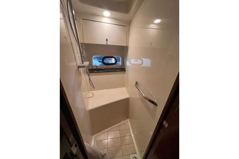  Yacht Photos Pics Shower area in 2015 Sea Ray 470 Sundancer yacht, featuring modern fixtures and a window.
