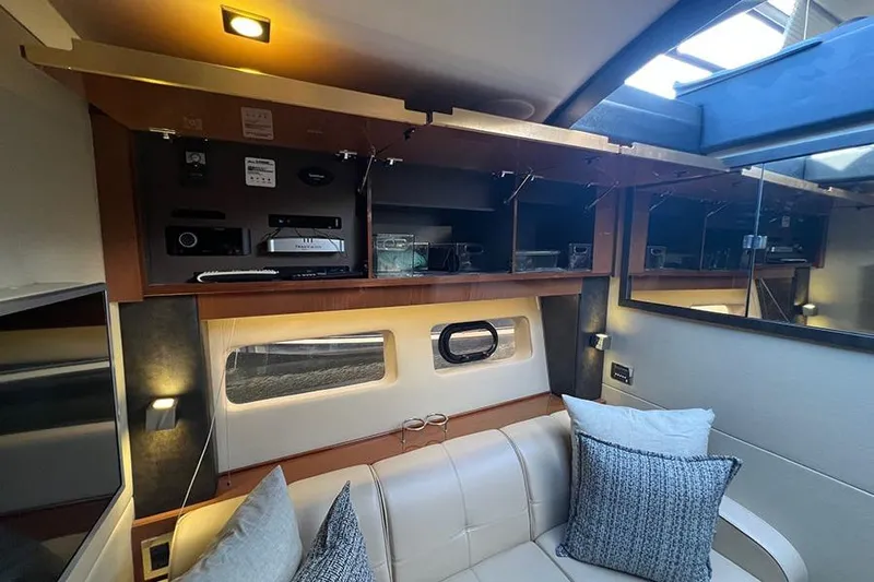  Yacht Photos Pics Luxurious interior of 2015 Sea Ray 470 Sundancer yacht with modern amenities and comfortable seating.