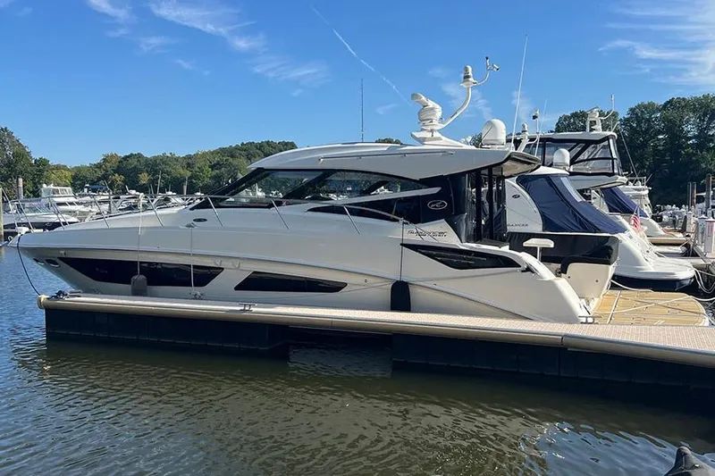  Yacht Photos Pics 2015 Sea Ray 470 Sundancer yacht docked at marina under clear blue sky.