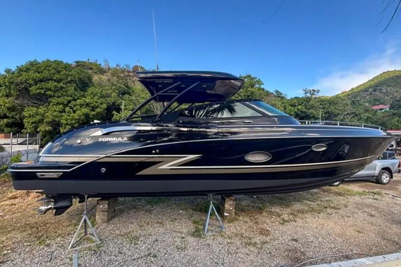Cri Stellae Yacht Photos Pics 2018 Formula 350 Crossover Bowrider boat on stands, surrounded by greenery and clear blue sky.