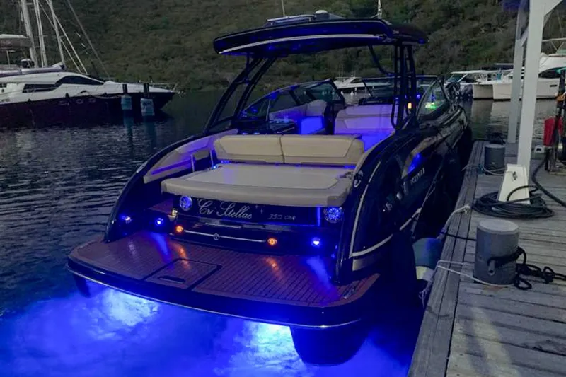 Cri Stellae Yacht Photos Pics 2018 Formula 350 Crossover Bowrider with blue LED lights docked at marina.