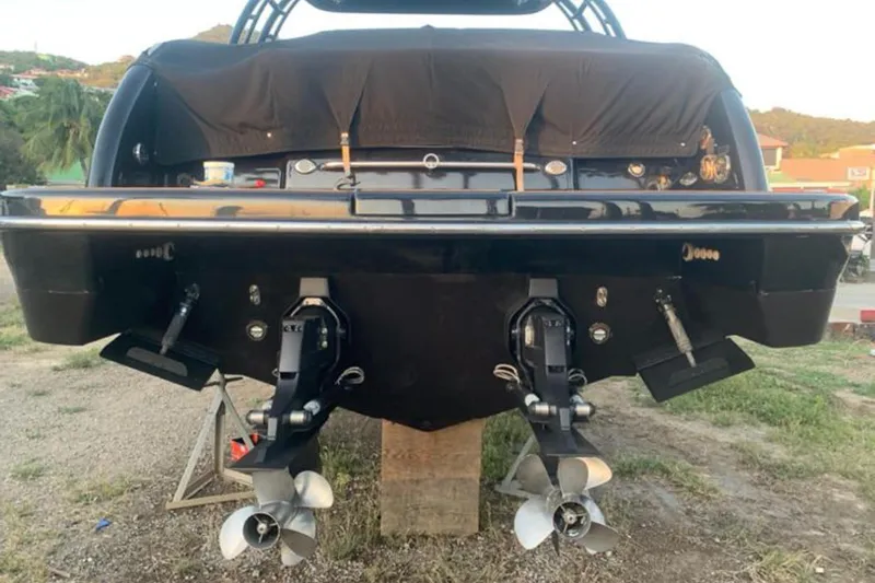 Cri Stellae Yacht Photos Pics 2018 Formula 350 Crossover Bowrider, rear view with dual propellers, on land.