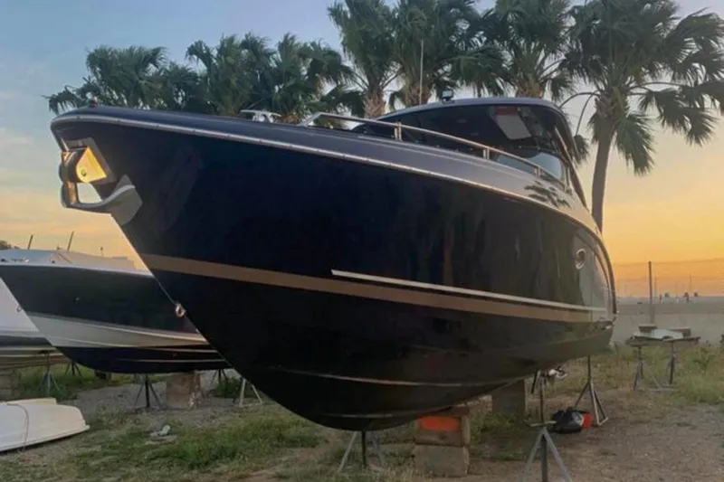 Cri Stellae Yacht Photos Pics 2018 Formula 350 Crossover Bowrider boat on land, sunset background, palm trees.