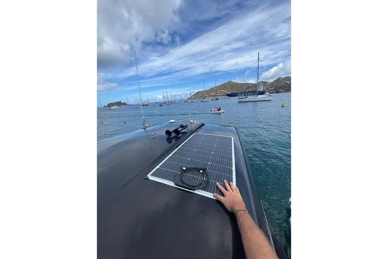 Cri Stellae Yacht Photos Pics 2018 Formula 350 Crossover Bowrider with solar panel on deck, anchored in scenic bay.