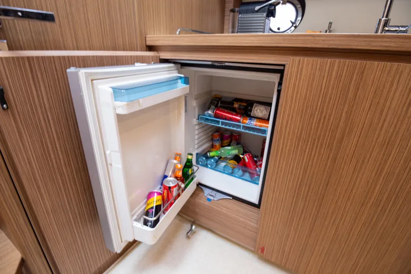  Yacht Photos Pics Mini fridge stocked with drinks inside 2017 Azimut 34 yacht kitchen.