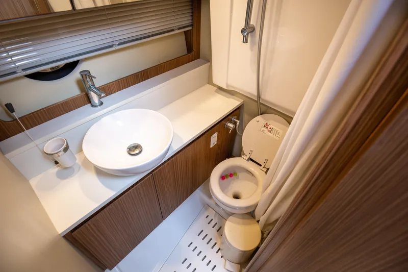  Yacht Photos Pics Modern bathroom in 2017 Azimut 34 yacht with sink, toilet, and shower.
