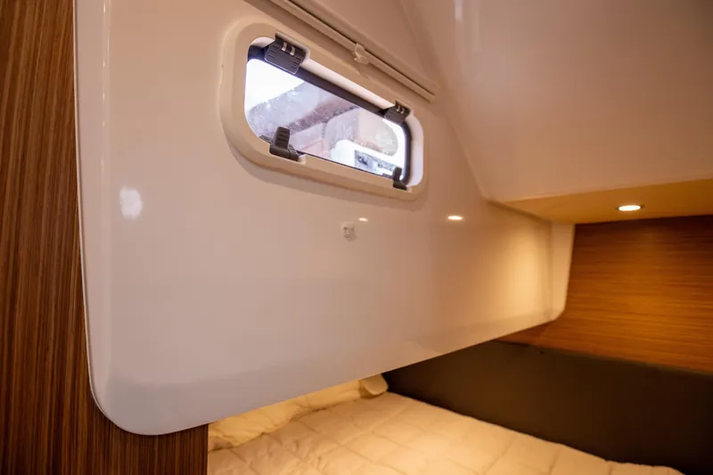  Yacht Photos Pics Interior cabin of 2017 Azimut 34 yacht with window and wood paneling.
