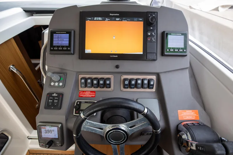  Yacht Photos Pics Control panel of a 2017 Azimut 34 yacht with navigation equipment.