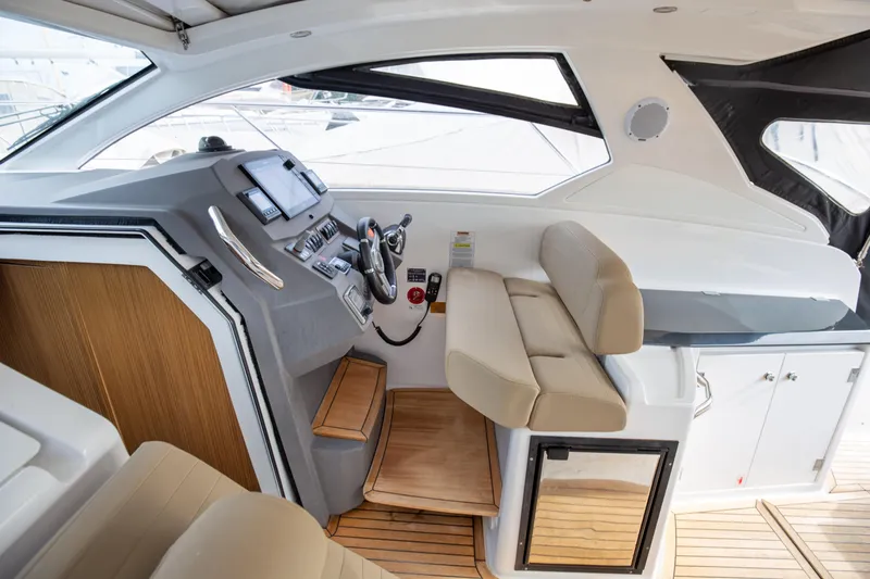  Yacht Photos Pics Luxurious interior of 2017 Azimut 34 yacht with modern helm and seating.