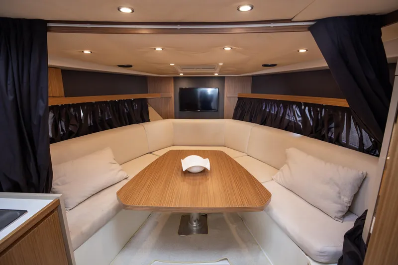  Yacht Photos Pics Luxurious interior of 2017 Azimut 34 yacht with elegant seating and wooden table.