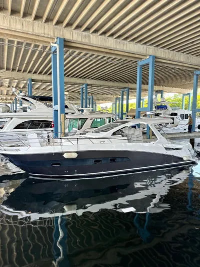  Yacht Photos Pics 2020 Azimut Verve 40 yacht docked under a covered marina.