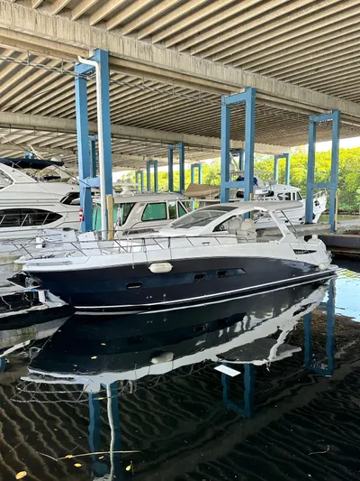  Yacht Photos Pics 2020 Azimut Verve 40 yacht docked under a covered marina.