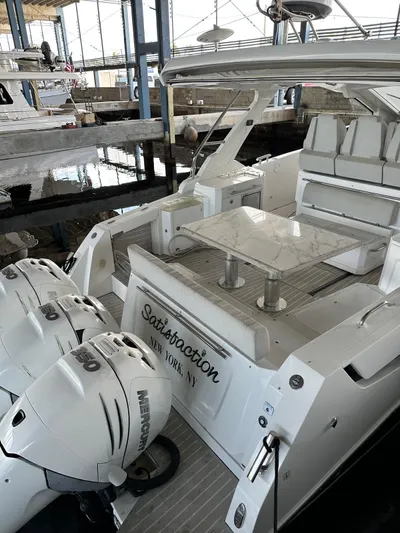  Yacht Photos Pics 2020 Azimut Verve 40 yacht docked, featuring spacious seating and twin outboard engines.