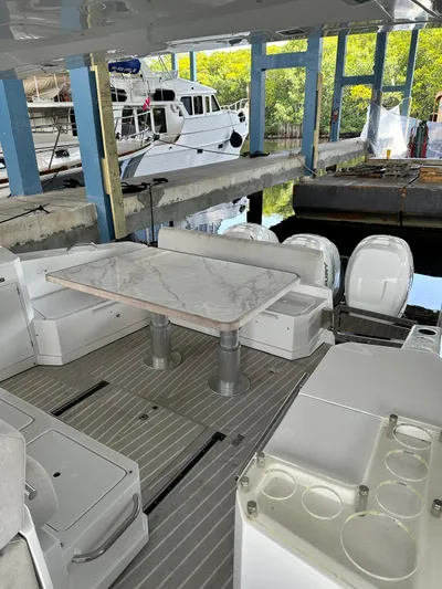  Yacht Photos Pics Azimut Verve 40 yacht interior, 2020 model, featuring a sleek dining area with marble table.