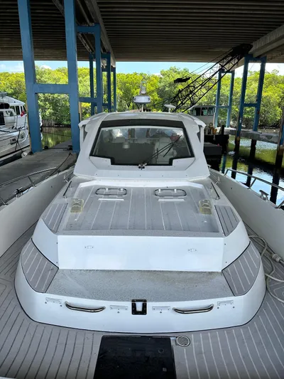  Yacht Photos Pics 2020 Azimut Verve 40 yacht docked under a covered marina.