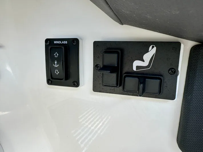  Yacht Photos Pics Cobalt R8 Outboard 2022 boat controls, featuring windlass and seat adjustment switches.