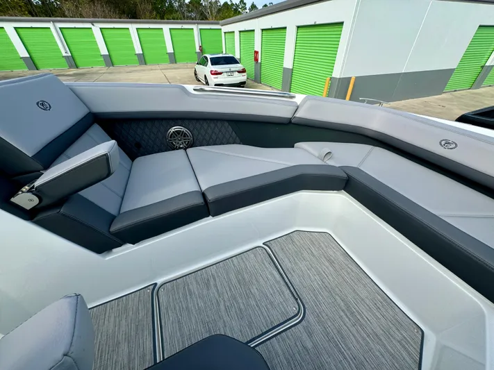  Yacht Photos Pics 2022 Cobalt R8 Outboard boat interior with gray seating and storage units in background.