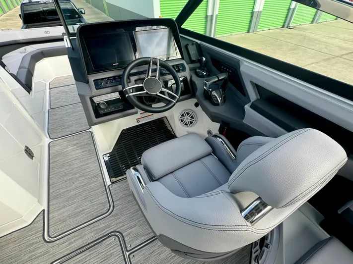  Yacht Photos Pics 2022 Cobalt R8 Outboard boat cockpit with modern controls and comfortable seating.