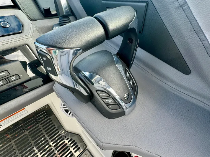  Yacht Photos Pics Close-up of 2022 Cobalt R8 Outboard boat throttle control in cockpit.