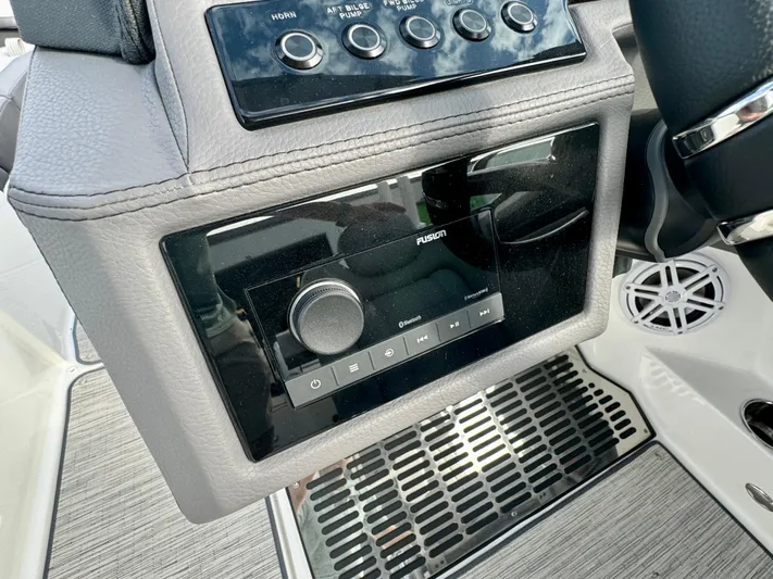  Yacht Photos Pics 2022 Cobalt R8 Outboard boat dashboard with Fusion audio system and control panel.