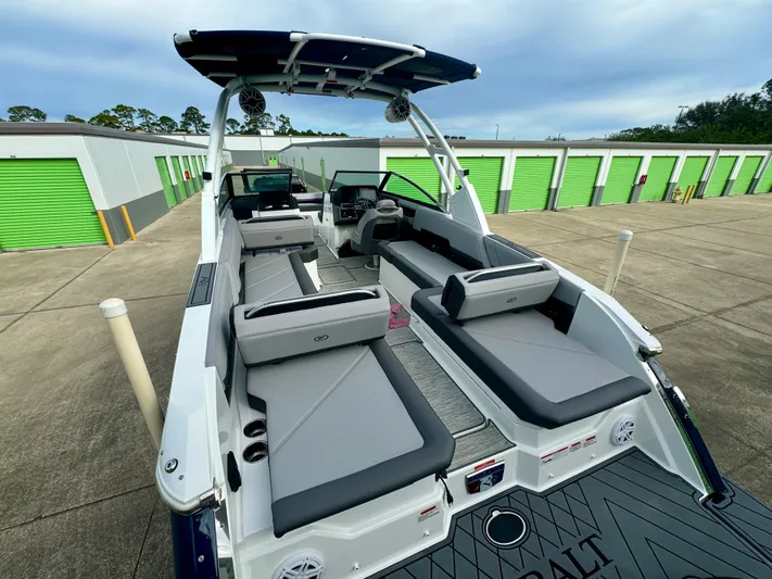  Yacht Photos Pics 2022 Cobalt R8 Outboard boat with sleek seating and modern design in storage facility.