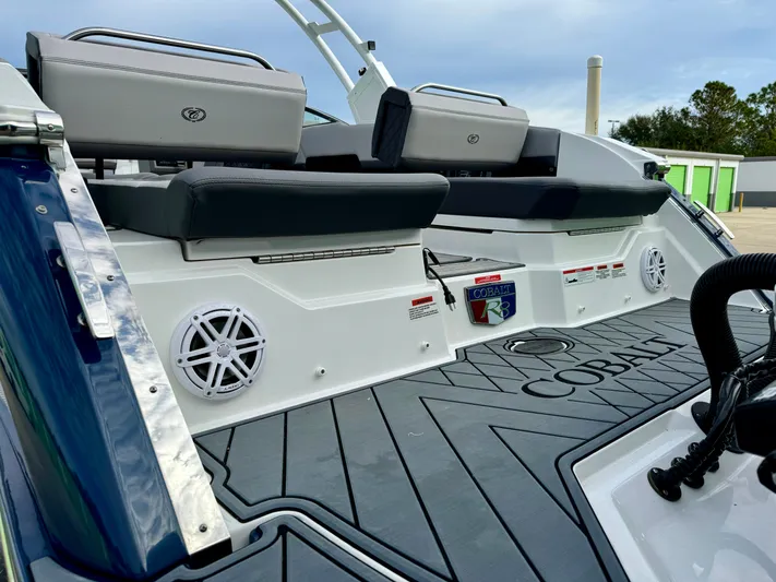  Yacht Photos Pics 2022 Cobalt R8 Outboard boat interior with cushioned seating and speakers.