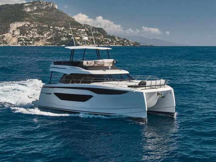  Yacht Photos Pics Luxury Prestige M48 yacht cruising in blue ocean near scenic coastline, 2025 model.