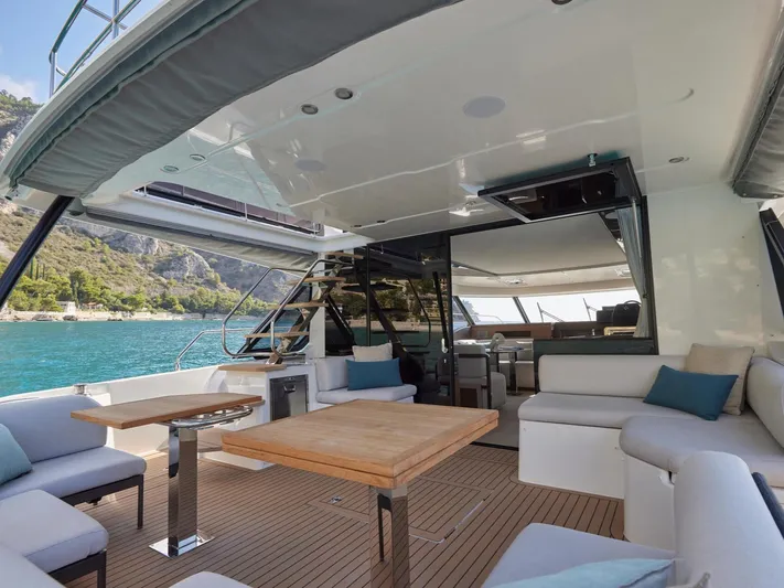  Yacht Photos Pics Luxurious 2025 Prestige M48 yacht interior with elegant seating and scenic ocean view.