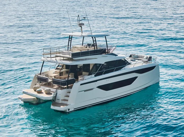  Yacht Photos Pics Luxurious 2025 Prestige M48 yacht cruising on clear blue waters.