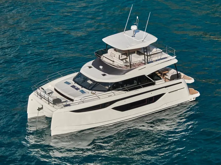  Yacht Photos Pics Luxury 2025 Prestige M48 yacht cruising on clear blue water.