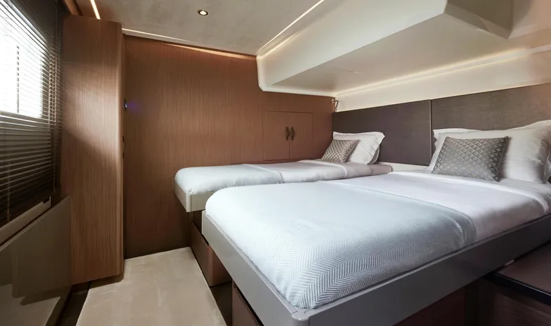  Yacht Photos Pics Luxurious twin bedroom in 2025 Prestige M48 yacht, featuring modern design and elegant decor.