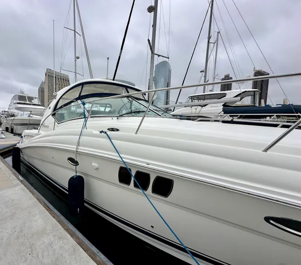 Aztec Princess Yacht Photos Pics 2006 Sea Ray 44 Sundancer yacht docked at marina, overcast sky.