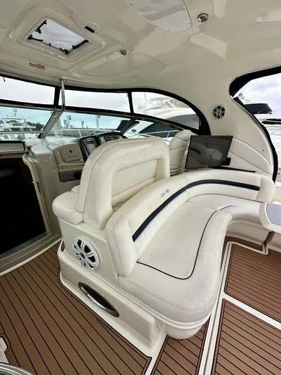Aztec Princess Yacht Photos Pics 2006 Sea Ray 44 Sundancer interior with white seating and wood flooring.