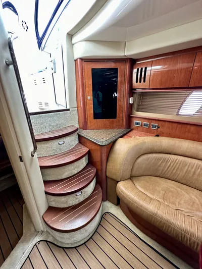 Aztec Princess Yacht Photos Pics Interior of 2006 Sea Ray 44 Sundancer with wooden stairs and leather seating.